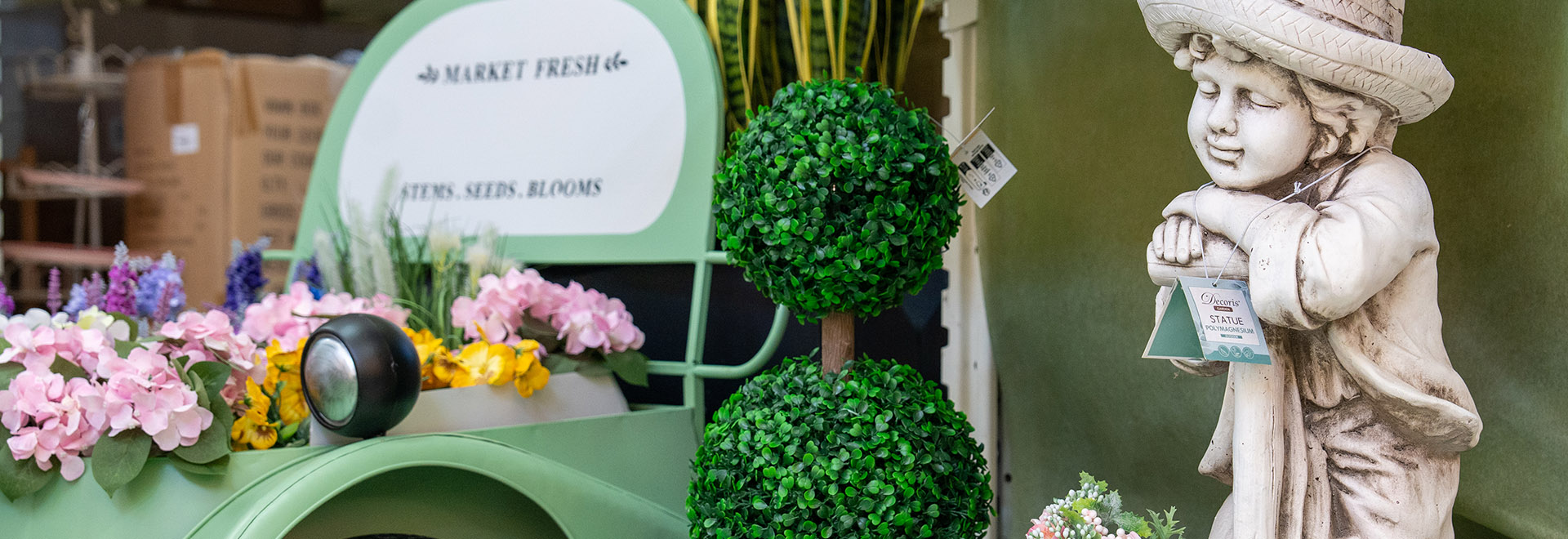 Carretto fiori con statua